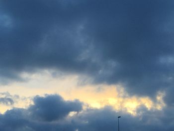 Low angle view of cloudy sky during sunset