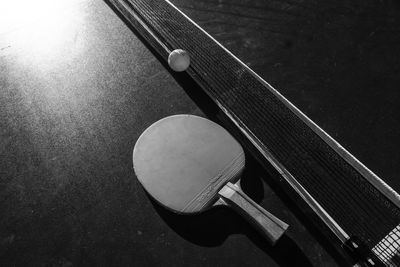 Close-up of table tennis paddle and ball