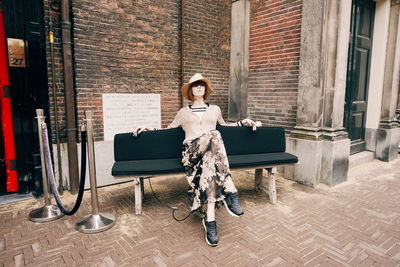 Portrait of woman sitting on chair