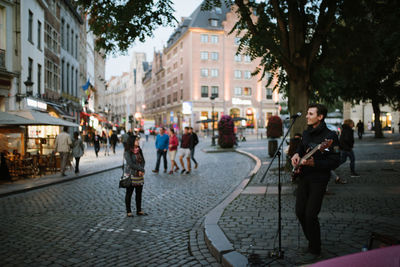 People walking on street in city