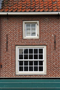 Full frame shot of window on brick wall of building