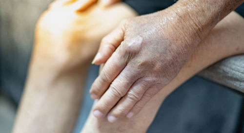 High angle view of couple hands