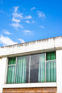 Low angle view of building against blue sky