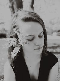 Portrait of a young woman with eyes closed
