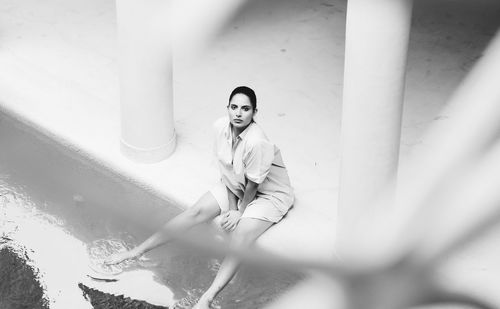 Woman having her feet in water