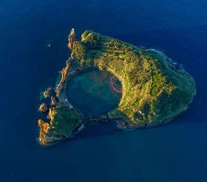 High angle view of rock on sea shore