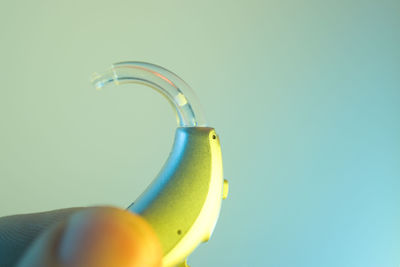 Close-up of banana against blue background