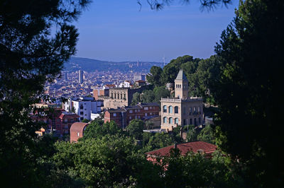 View of townscape against blue sky