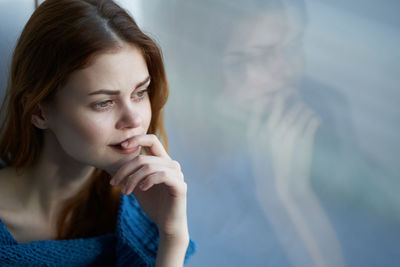 Portrait of young woman looking away