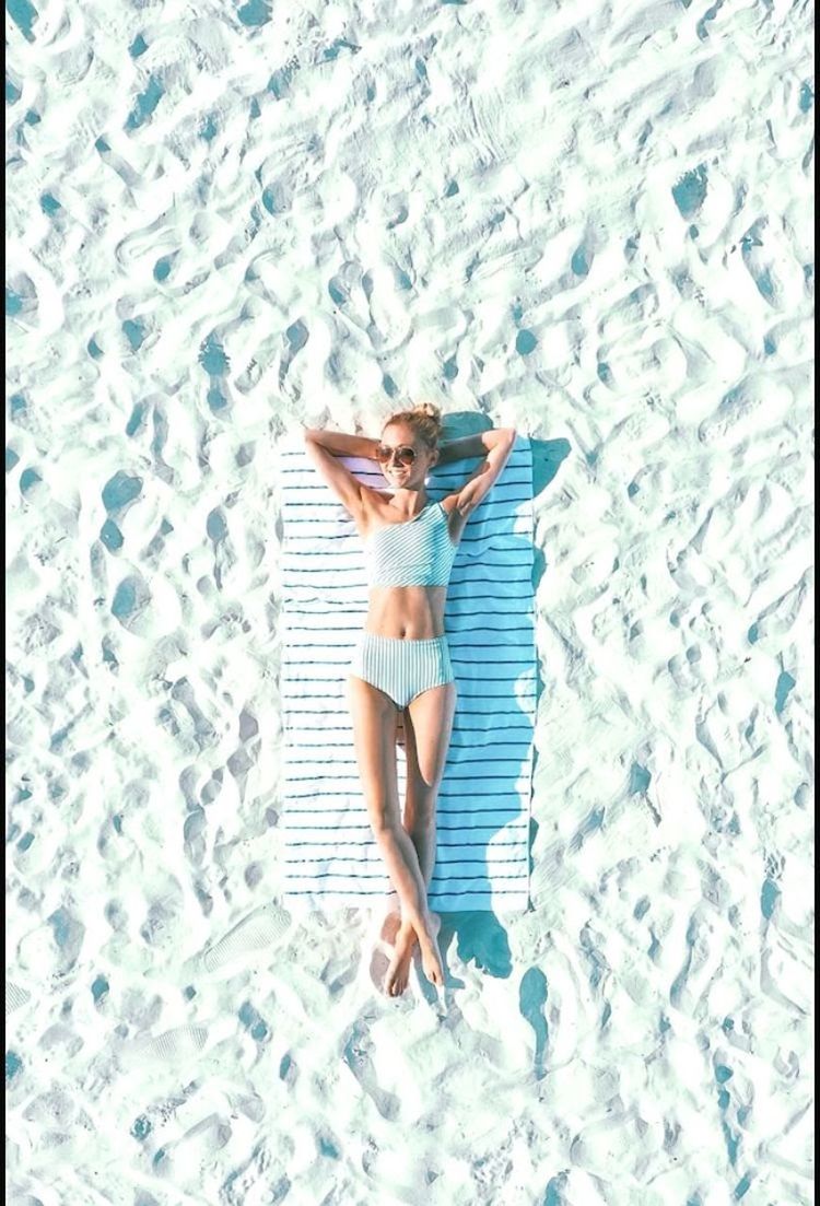 HIGH ANGLE VIEW OF WOMAN SWIMMING POOL