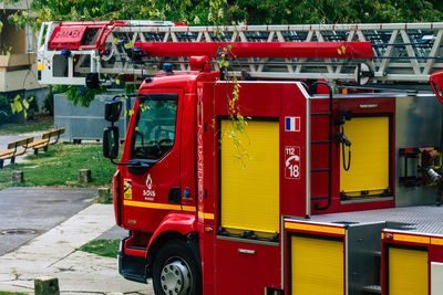 Red truck on road in city