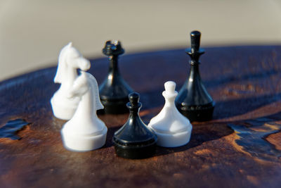 Close-up of chess pieces on table