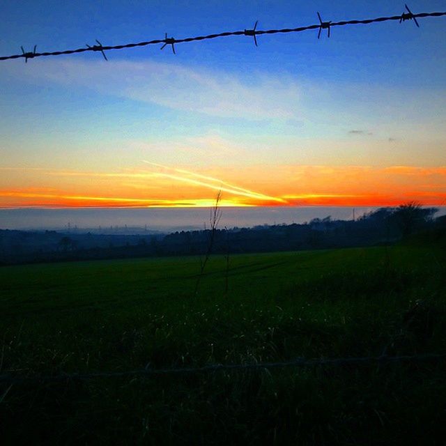 sunset, field, landscape, sky, rural scene, tranquility, fence, tranquil scene, scenics, orange color, beauty in nature, agriculture, nature, electricity pylon, barbed wire, farm, safety, protection, silhouette, security