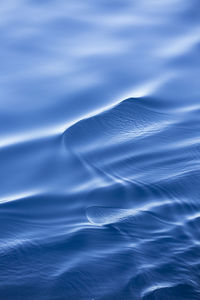 Scenic view of sea against blue sky