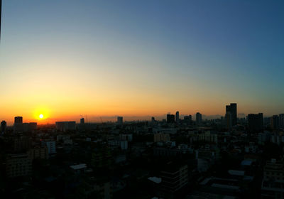 High angle view of buildings against sky during sunset