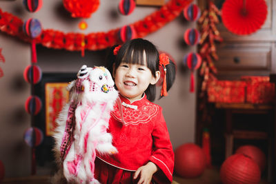 Full length of cute girl standing in traditional clothing