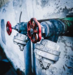 Close-up of rusty padlock on pipe