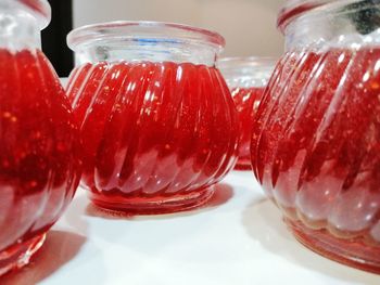 Close-up of ice cream in glass jar on table