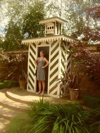 Woman in front of house