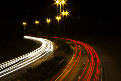 High angle view of light trails on road at night