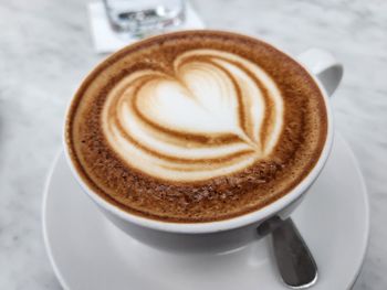 Close-up of cappuccino on table