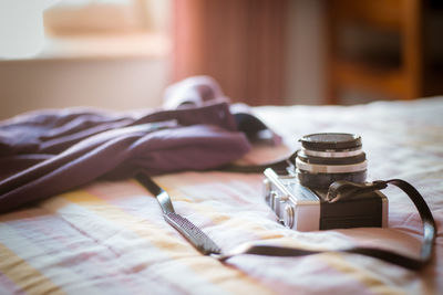 Camera with towel on bed