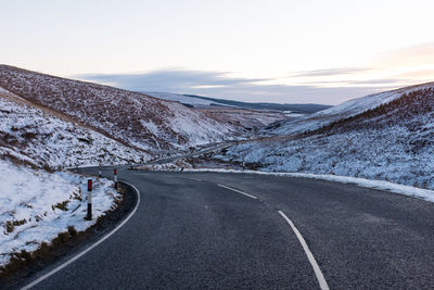 Scenic view of mountains against sky during winter