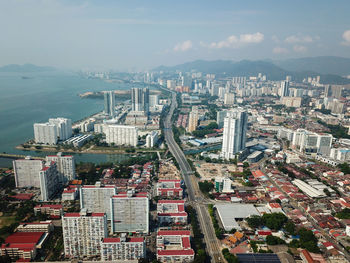 High angle view of buildings in city against sky