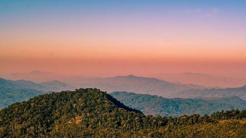 Scenic view of mountains against sky during sunset