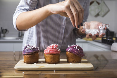 Woman preparing muffins at home