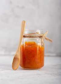 Close-up of drink in glass jar on table