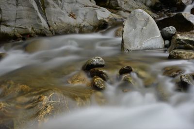 Close-up of rocks in river