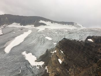 Scenic view of landscape against sky during winter