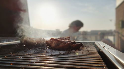 Close-up of meat on barbecue grill