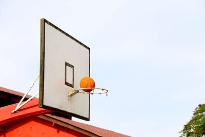 Low angle view of basketball hoop against sky