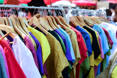 Multi colored clothing for sale in store