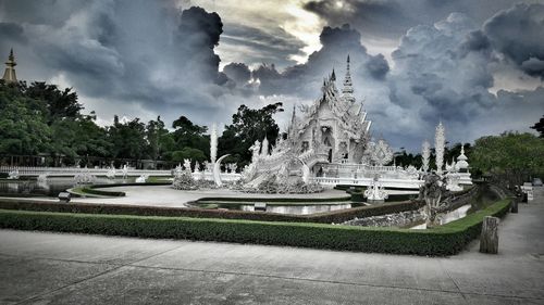 View of fountain against cloudy sky