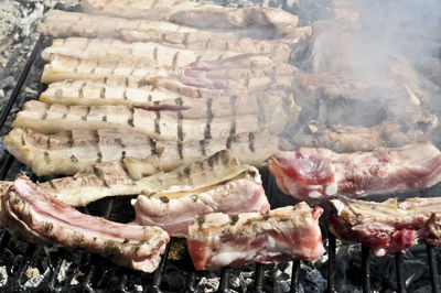 Tentacles of octopus being grilled on barbecue
