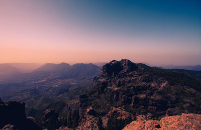 Scenic view of mountain against sky during sunset