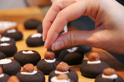 Close-up of person hand holding chess pieces