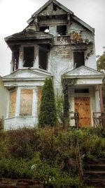 Low angle view of abandoned building against sky