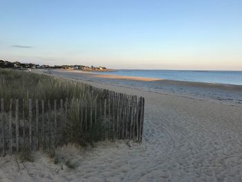 Scenic view of beach against clear sky