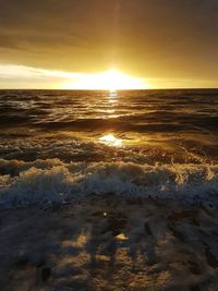 Scenic view of beach against sky during sunset