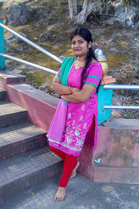 Portrait of a smiling young woman outdoors