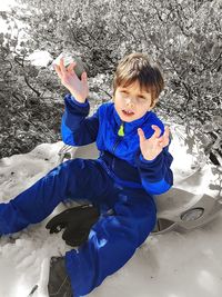 High angle view of boy on field during winter