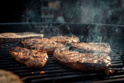 Close-up of meat on barbecue grill