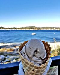 Close-up of ice cream on beach