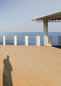 Scenic view of beach against clear sky