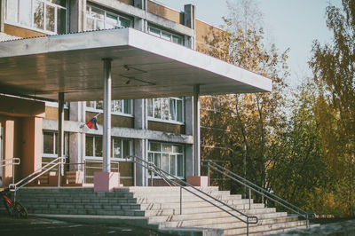 Staircase by building against trees