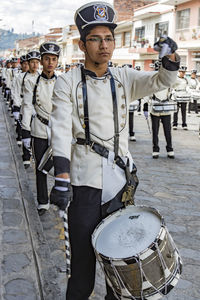 Full length portrait of people standing outdoors